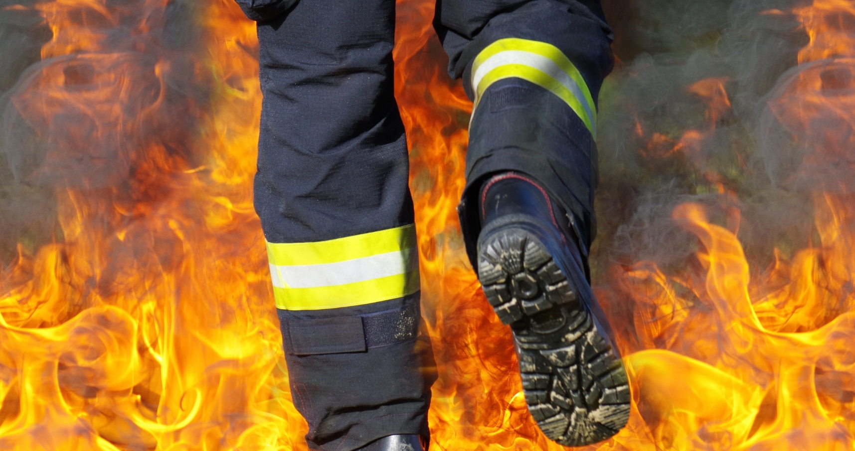 Fireman in boots walking into fire