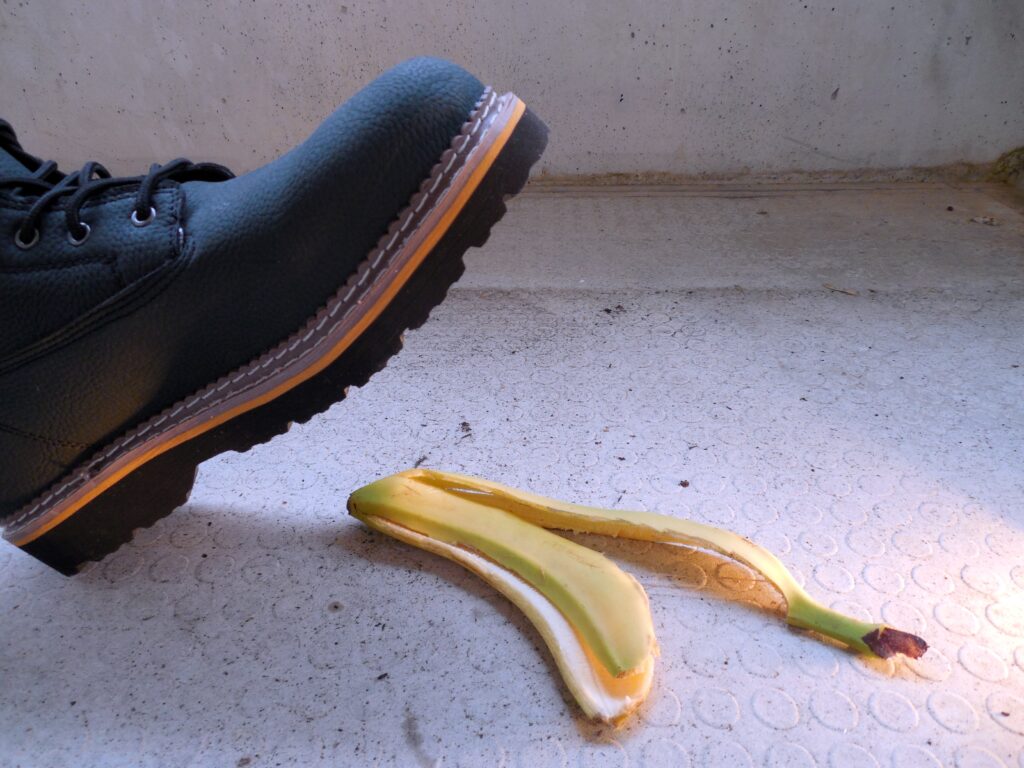 Shoe about to slip on a banana peel